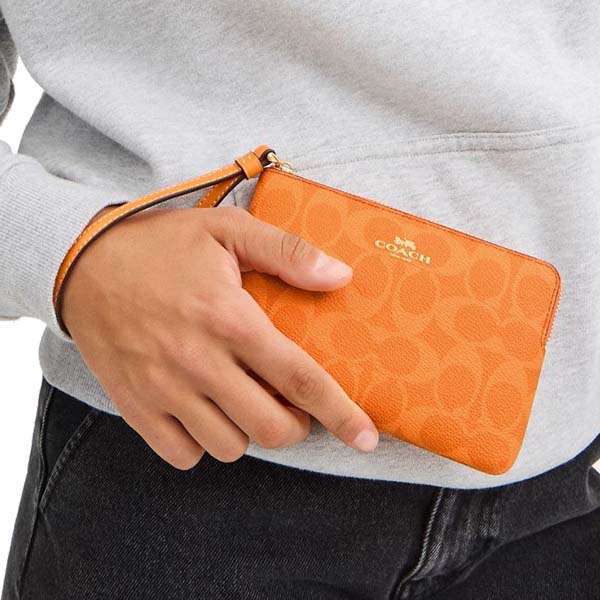 Coach Corner Zip Wristlet In Signature Canvas Bright Mandarin # CAQ75